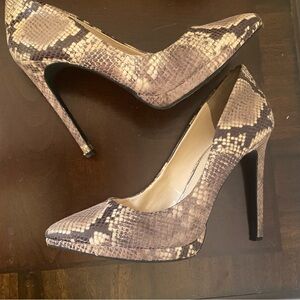 Slightly used Jessica Simpson snake skin it heels four is just high